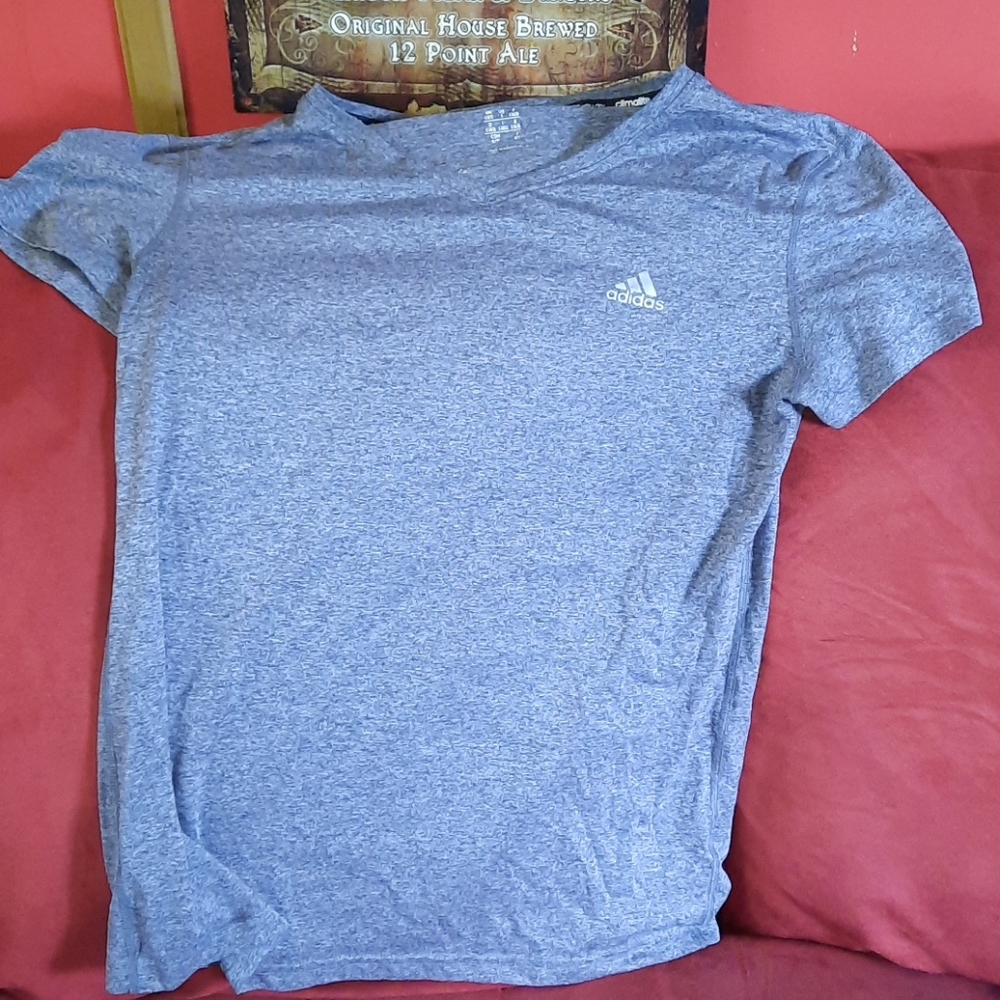 A grey Adidas workout shirt
